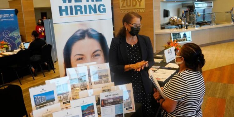US unemployment sinks to 3.9% as many more people find jobs