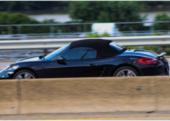 Jack takes his black Porsche Boxster for a spin