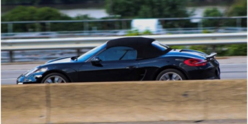 Jack takes his black Porsche Boxster for a spin