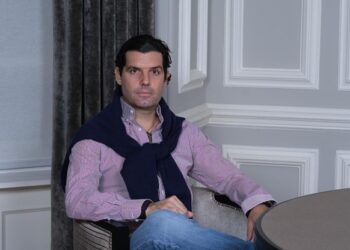 Alejandro Betancourt is setting on chair