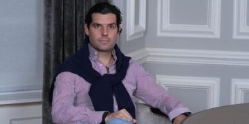 Alejandro Betancourt is setting on chair