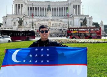 Khayotbek Ergashkhonov is holding flag