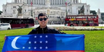 Khayotbek Ergashkhonov is holding flag