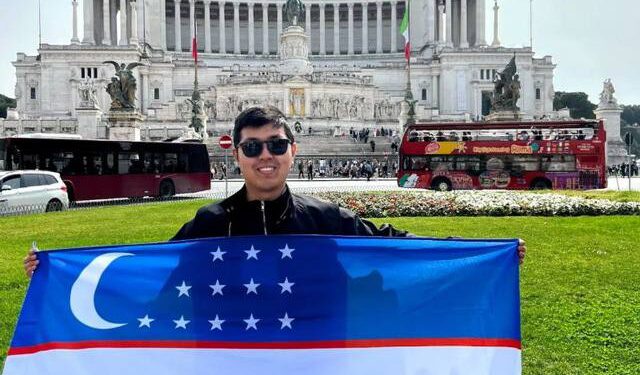 Khayotbek Ergashkhonov is holding flag